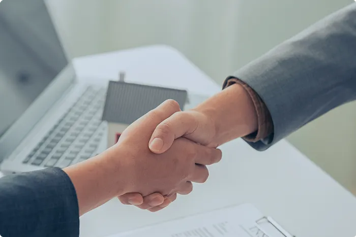 Handshake representing investment consultation